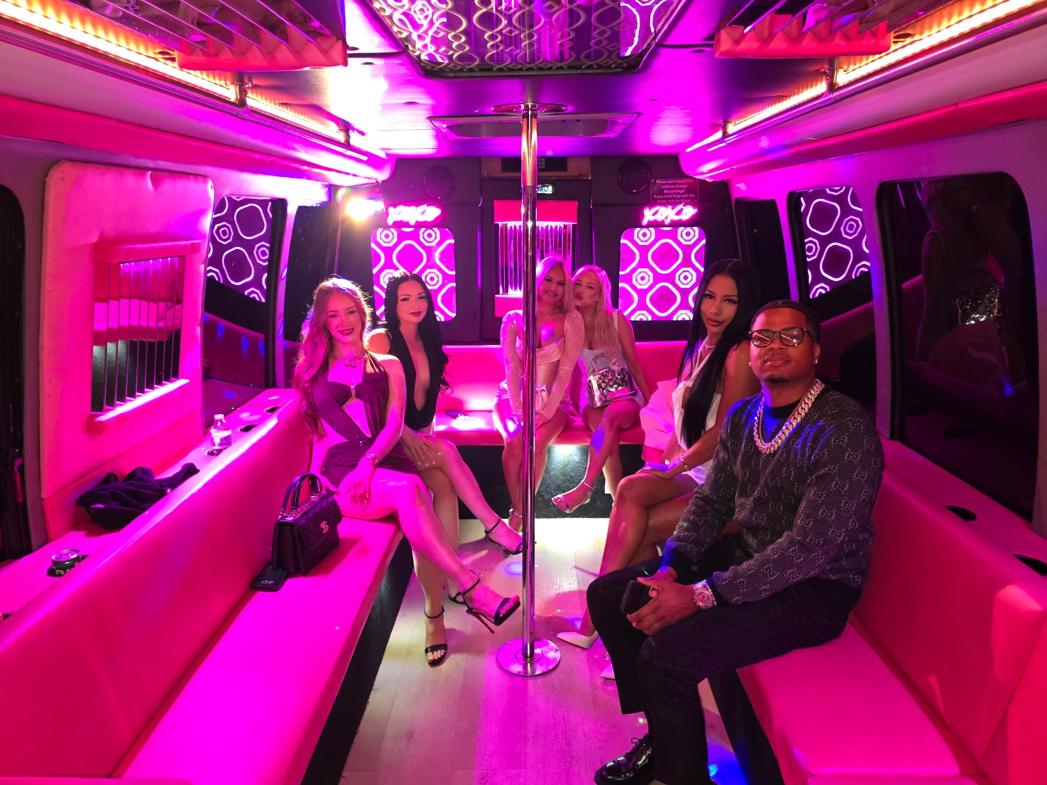 Bachelorette party group celebrating on the Pink Party Bus